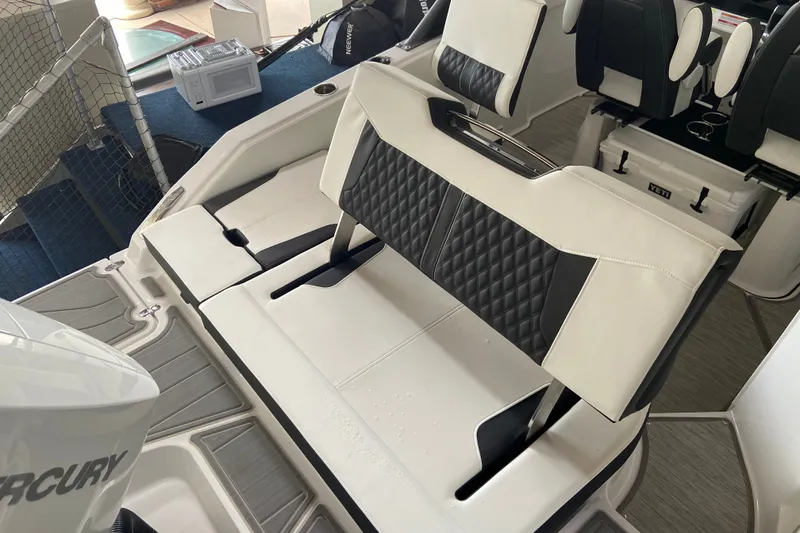 Slide: The Image of Luxurious seating on a 2027 Monterey Elite 25 OB boat, featuring quilted upholstery. - 4