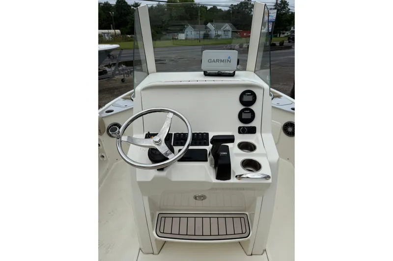 Slide: The Image of 2019 Stingray 206 CC boat console with Garmin navigation system and steering wheel. - 9
