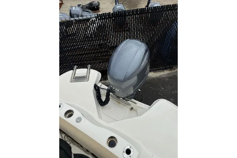 Slide: The Image of 2019 Stingray 206 CC boat with outboard motor and ladder, viewed from above. - 10
