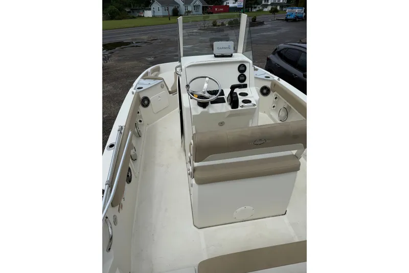 Slide: The Image of 2019 Stingray 206 CC boat interior with steering console and seating. - 5