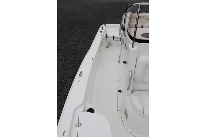 Slide: The Image of 2018 Sea Hunt BX21 boat interior, showcasing sleek white seating and deck design. - 21