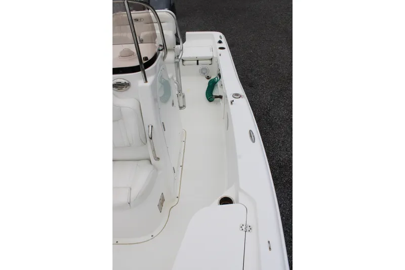 Slide: The Image of 2018 Sea Hunt BX21 boat interior with white seating and deck details. - 20