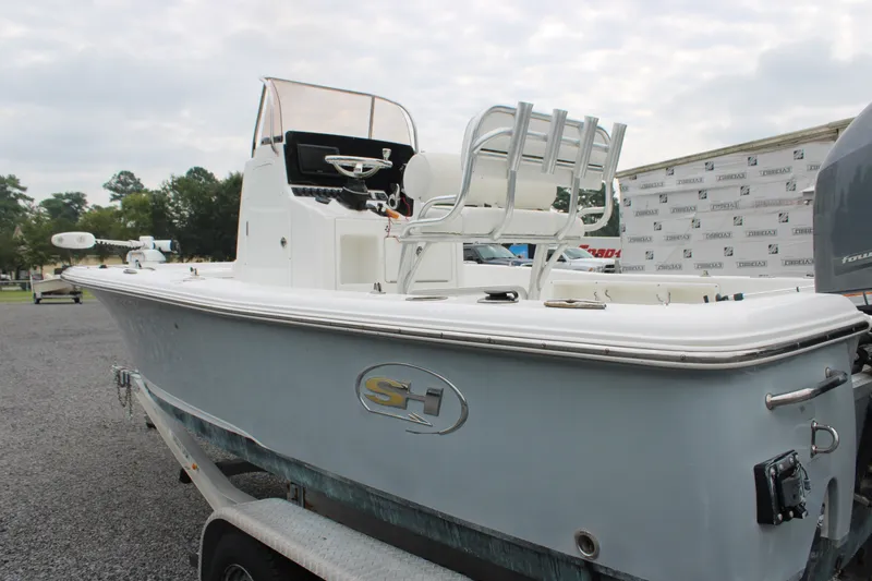 Slide: The Image of 2018 Sea Hunt BX21 boat on trailer, featuring sleek design and spacious seating. - 6