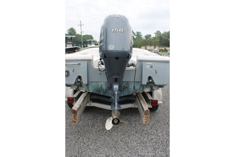 Slide: The Image of 2018 Sea Hunt BX21 boat with 150 horsepower outboard motor on trailer. - 7