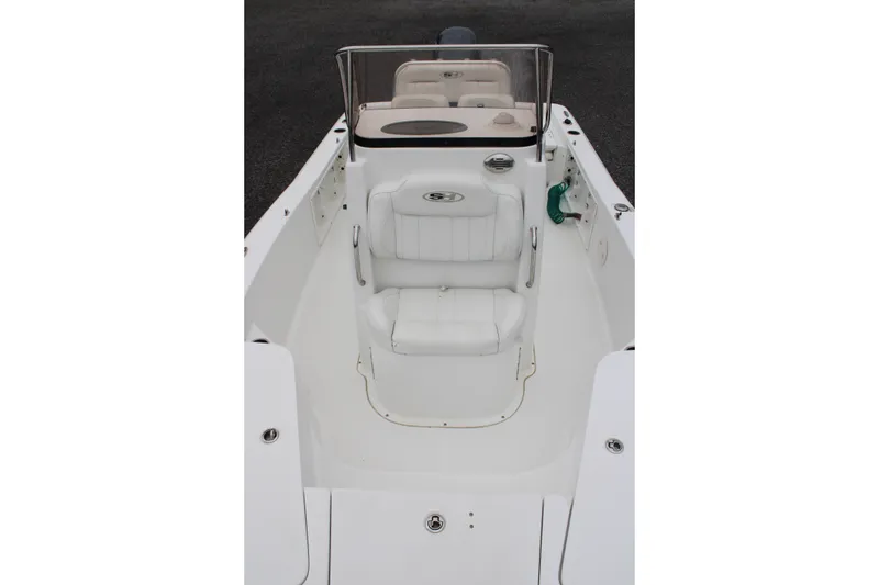 Slide: The Image of 2018 Sea Hunt BX21 boat interior with white seating and console. - 18