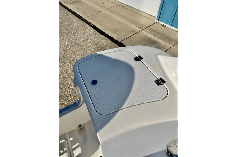Slide: The Image of 2013 Hurricane SunDeck 2200 OB boat deck with storage compartment and hinges. - 43