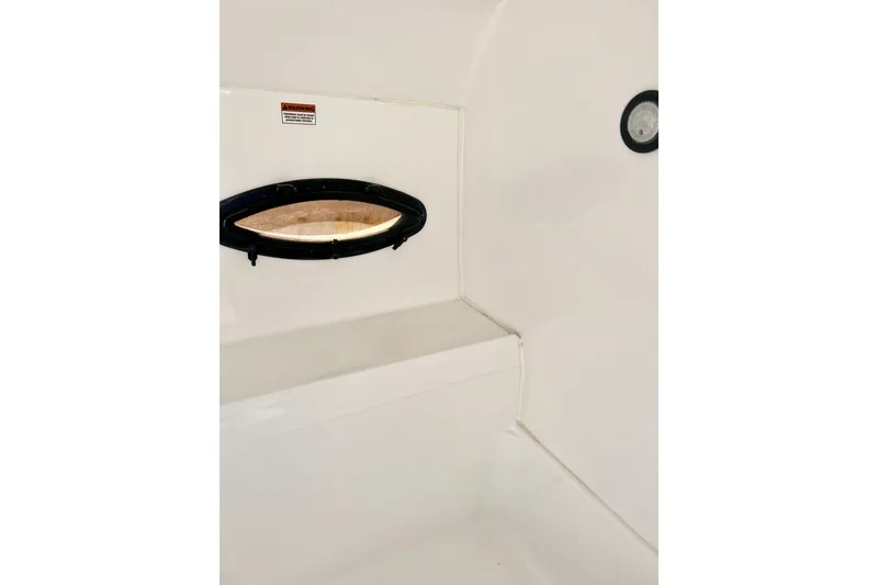 Slide: The Image of Interior view of 2013 Hurricane SunDeck 2200 OB boat cabin with porthole. - 38