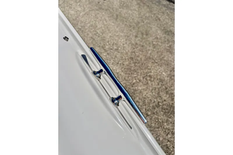 Slide: The Image of 2013 Hurricane SunDeck 2200 OB boat cleat on white surface. - 46