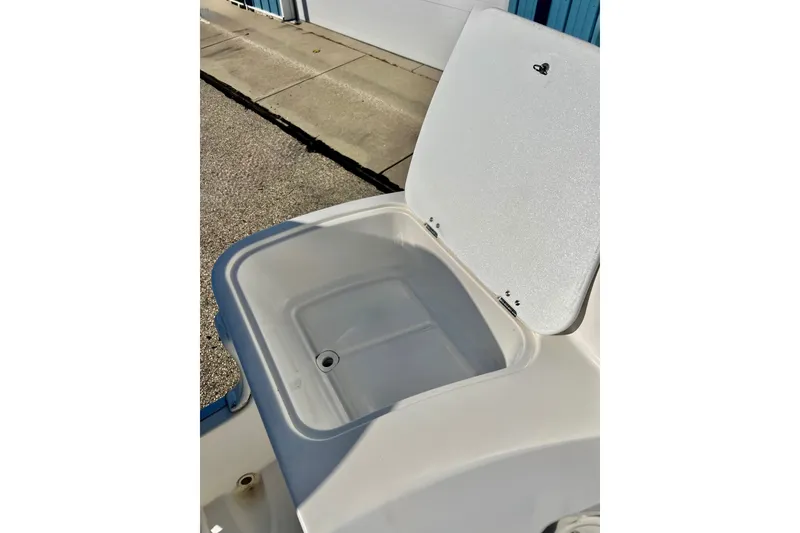 Slide: The Image of Open storage compartment on a 2013 Hurricane SunDeck 2200 OB boat. - 44