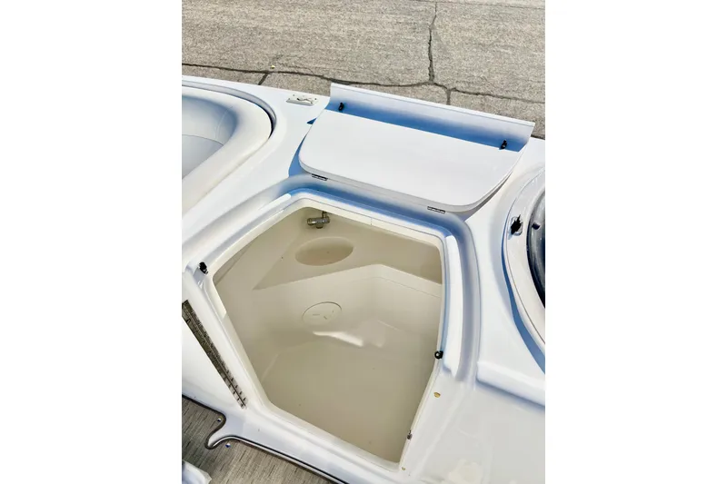 Slide: The Image of Open storage compartment on a 2013 Hurricane SunDeck 2200 OB boat. - 39