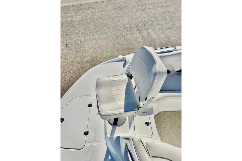 Slide: The Image of 2013 Hurricane SunDeck 2200 OB boat seat, white upholstery, deck view. - 54