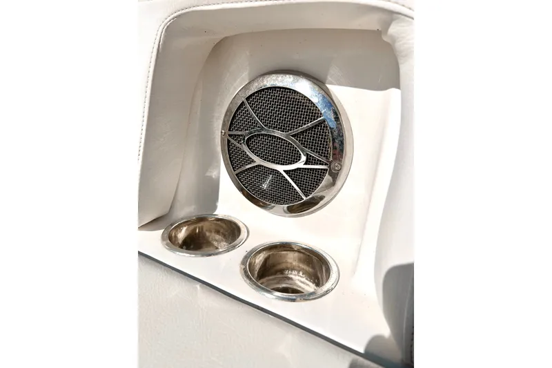 Slide: The Image of Speaker and cup holders on 2013 Hurricane SunDeck 2200 OB boat interior. - 30