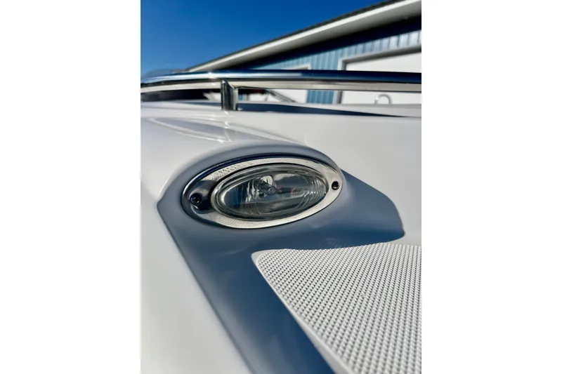 Slide: The Image of Close-up of a 2013 Hurricane SunDeck 2200 OB boat's light fixture and railing. - 70