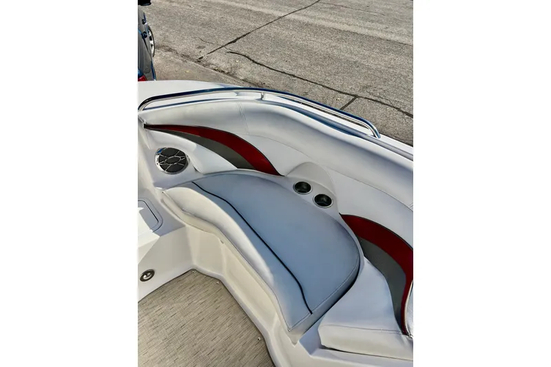 Slide: The Image of 2013 Hurricane SunDeck 2200 OB boat interior with cushioned seating and cup holders. - 47