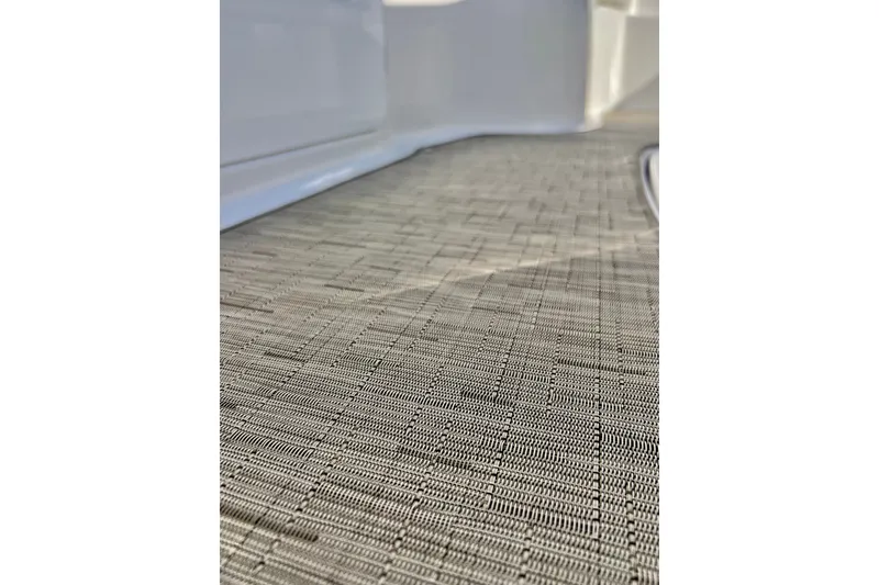 Slide: The Image of Close-up of textured flooring on a 2013 Hurricane SunDeck 2200 OB boat. - 60