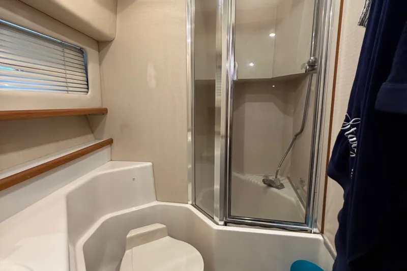 Slide: The Image of Bathroom interior of 2000 Bayliner 4788 Pilot House Motoryacht with shower and toilet. - 52