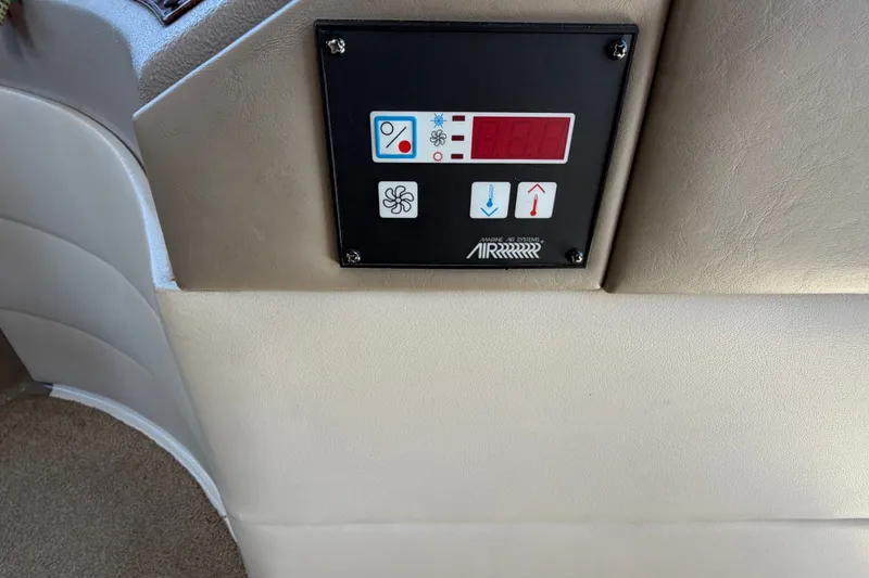 Slide: The Image of Control panel on 2000 Bayliner 4788 Pilot House Motoryacht, featuring temperature and fan settings. - 35