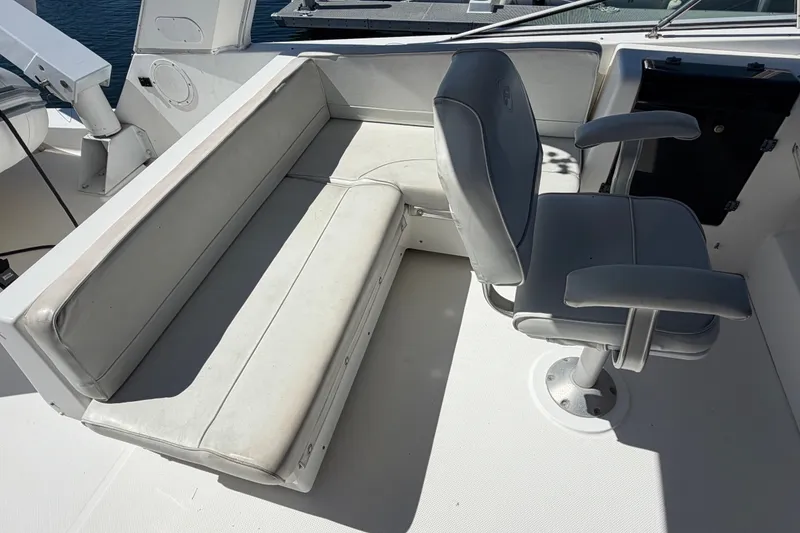Slide: The Image of Bayliner 4788 Pilot House Motoryacht 2000 interior seating and helm chair. - 19