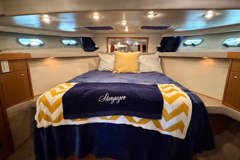 Slide: The Image of Luxurious cabin interior of 2000 Bayliner 4788 Pilot House Motoryacht with cozy bedding. - 46