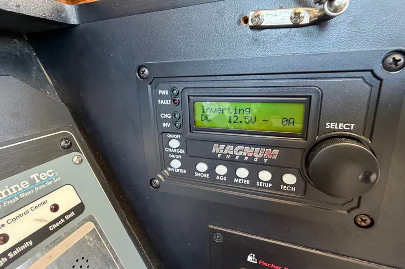 Slide: The Image of Control panel on a 2000 Bayliner 4788 Pilot House Motoryacht, displaying inverter status. - 39