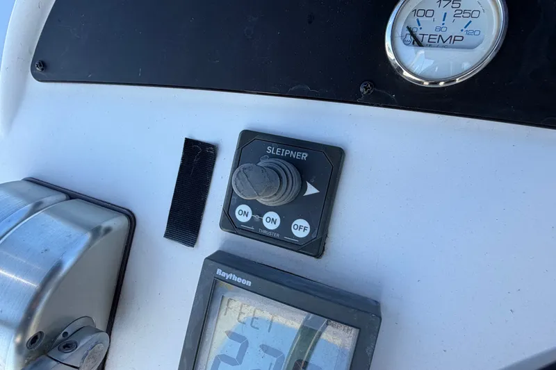 Slide: The Image of Control panel of a 2000 Bayliner 4788 Pilot House Motoryacht with temperature gauge. - 21