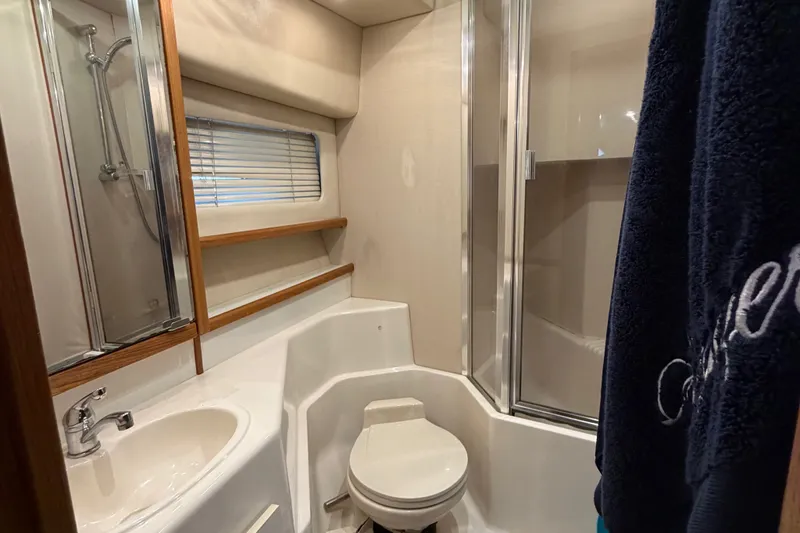 Slide: The Image of Bathroom interior of 2000 Bayliner 4788 Pilot House Motoryacht with shower and sink. - 51