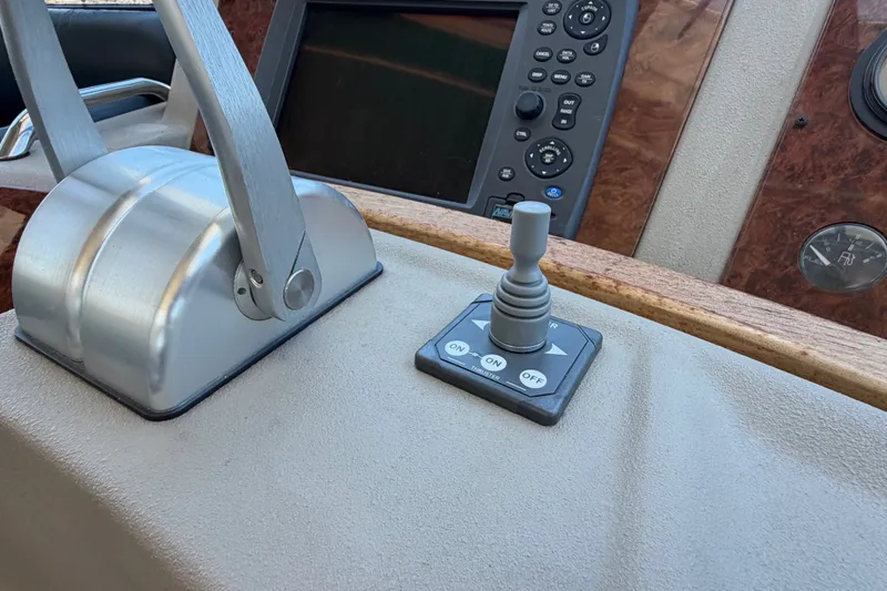 Slide: The Image of Control panel of a 2000 Bayliner 4788 Pilot House Motoryacht with throttle and joystick. - 36