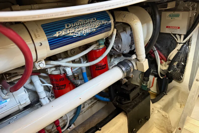 Slide: The Image of Engine compartment of 2000 Bayliner 4788 Pilot House Motoryacht with Diamond Performance Series components. - 57