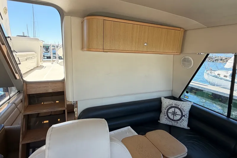 Slide: The Image of Interior of 2000 Bayliner 4788 Pilot House Motoryacht with seating and nautical decor. - 37