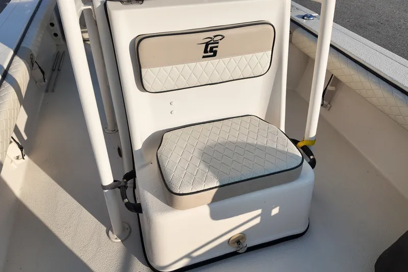 Slide: The Image of 2021 Carolina Skiff 24 Ultra Elite boat seat with diamond-patterned upholstery. - 8