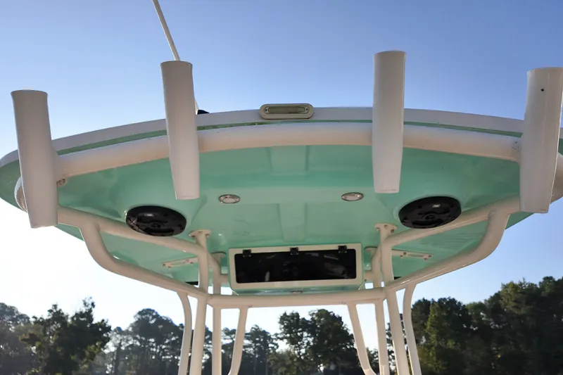 Slide: The Image of 2021 Carolina Skiff 24 Ultra Elite boat top view with rod holders and speakers. - 15