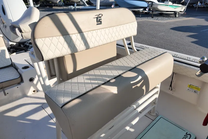 Slide: The Image of 2021 Carolina Skiff 24 Ultra Elite boat seating with diamond-pattern upholstery. - 13