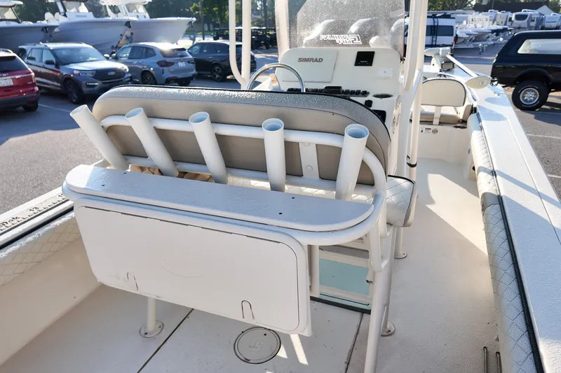 Slide: The Image of 2021 Carolina Skiff 24 Ultra Elite boat interior with rod holders and console. - 12