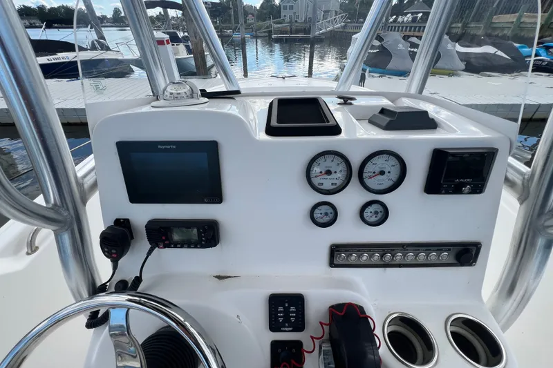 Slide: The Image of Center console of 2021 Tidewater 198 CC Adventure boat with gauges and electronics. - 15