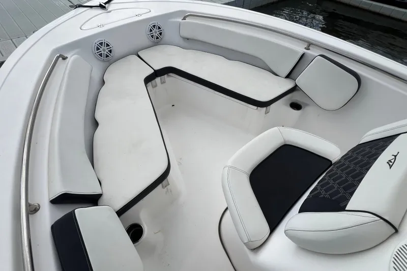Slide: The Image of 2021 Tidewater 198 CC Adventure boat interior with cushioned seating and speakers. - 4