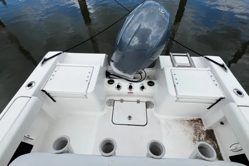 Slide: The Image of 2021 Tidewater 198 CC Adventure boat with outboard motor and fishing rod holders. - 9