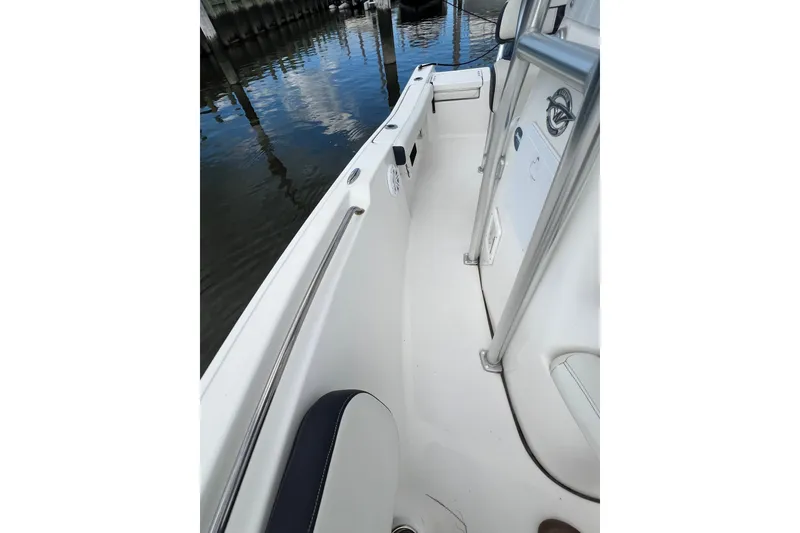 Slide: The Image of 2021 Tidewater 198 CC Adventure boat interior with sleek design and stainless steel railing. - 7