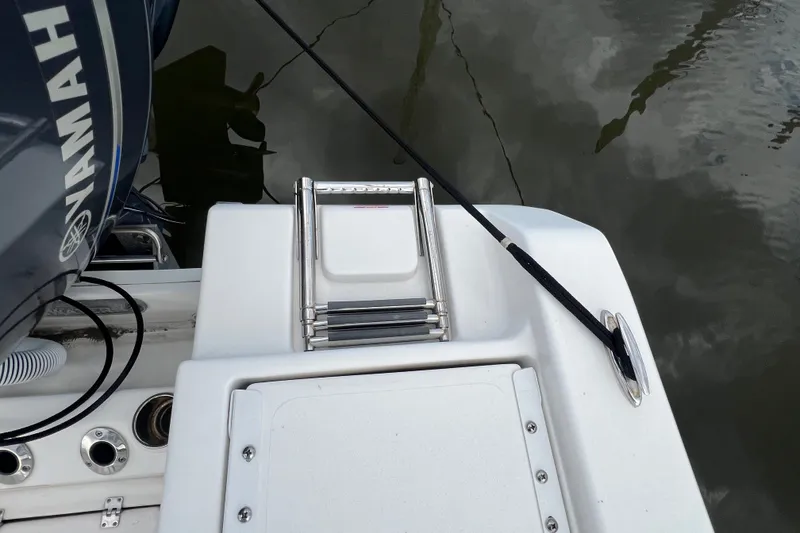 Slide: The Image of 2021 Tidewater 198 CC Adventure boat with Yamaha engine and swim ladder. - 11