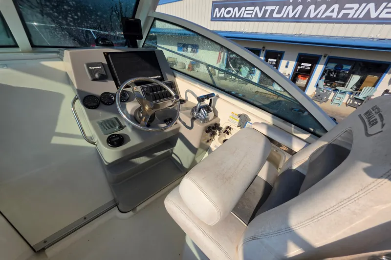 Slide: The Image of Interior cockpit of 2012 Boston Whaler 285 Conquest boat at Momentum Marine. - 11