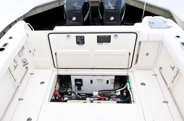 Slide: The Image of Manufacturer Provided Image: 2012 Boston Whaler 285 Conquest engine compartment with twin Mercury outboards. - 22
