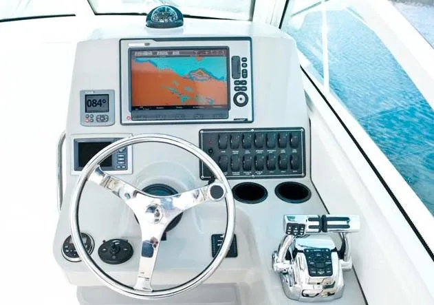 Slide: The Image of Manufacturer Provided Image: 2012 Boston Whaler 285 Conquest helm with navigation system and controls. - 21