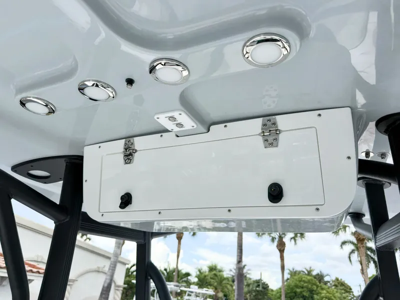 Slide: The Image of The image shows the roof of a Sea Hunt Ultra 219 boat with built-in lights. - 18