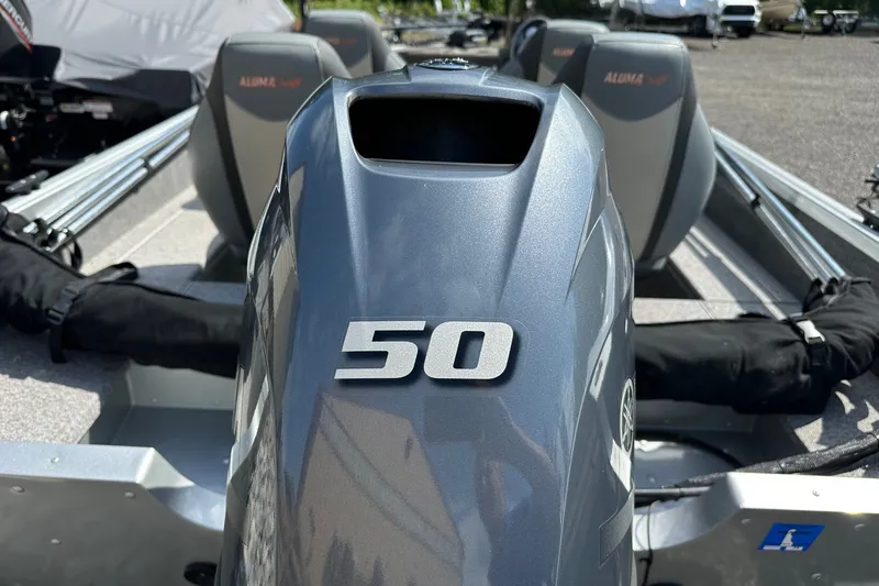 Slide: The Image of 2021 Alumacraft Classic 165 CS boat with a 50 HP engine, interior view. - 7