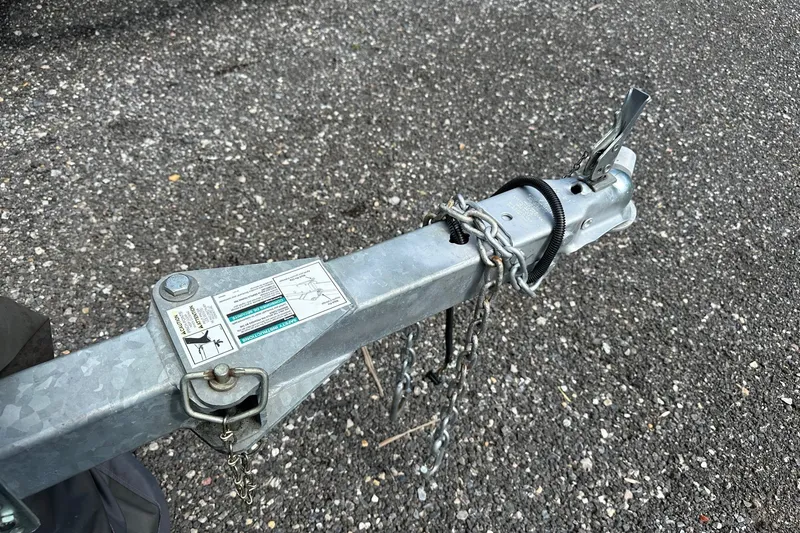Slide: The Image of Trailer hitch of a 2021 Alumacraft Classic 165 CS on gravel surface. - 20