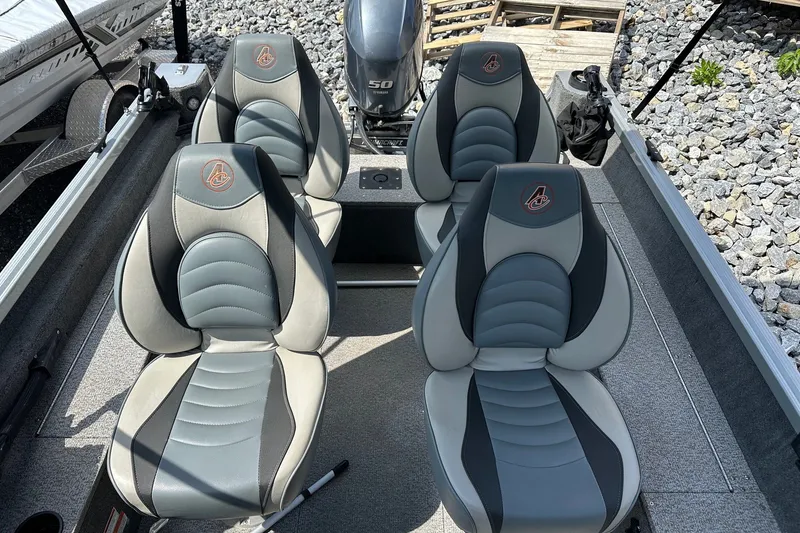 Slide: The Image of 2021 Alumacraft Classic 165 CS boat interior with four cushioned seats and Yamaha 50 engine. - 14