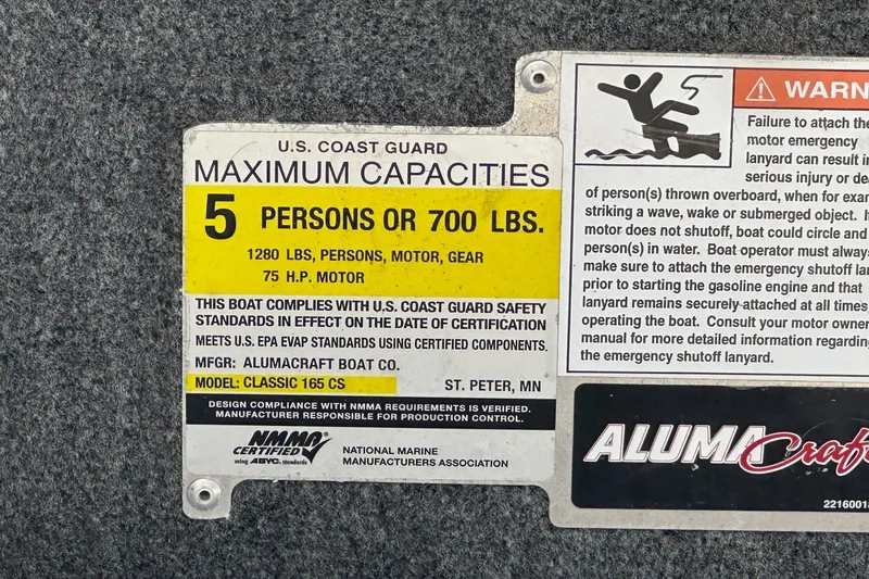 Slide: The Image of 2021 Alumacraft Classic 165 CS capacity label: 5 persons or 700 lbs, 75 HP motor. - 11