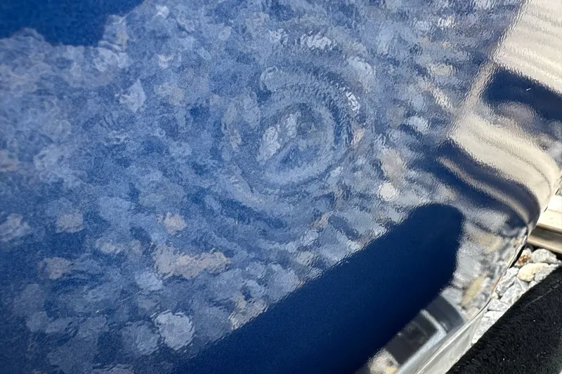 Slide: The Image of Close-up of 2021 Alumacraft Classic 165 CS boat's textured blue surface. - 25