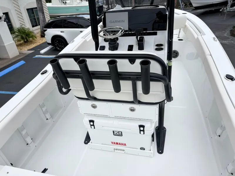 Slide: The Image of The image shows the cockpit of a Sea Hunt Ultra 219 boat with a Garmin display and rod holders. - 12