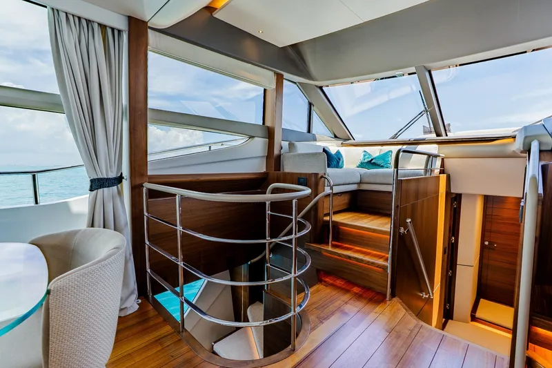 Slide: The Image of Luxurious interior of 2022 Princess Y78 yacht with elegant staircase and seating area. - 15