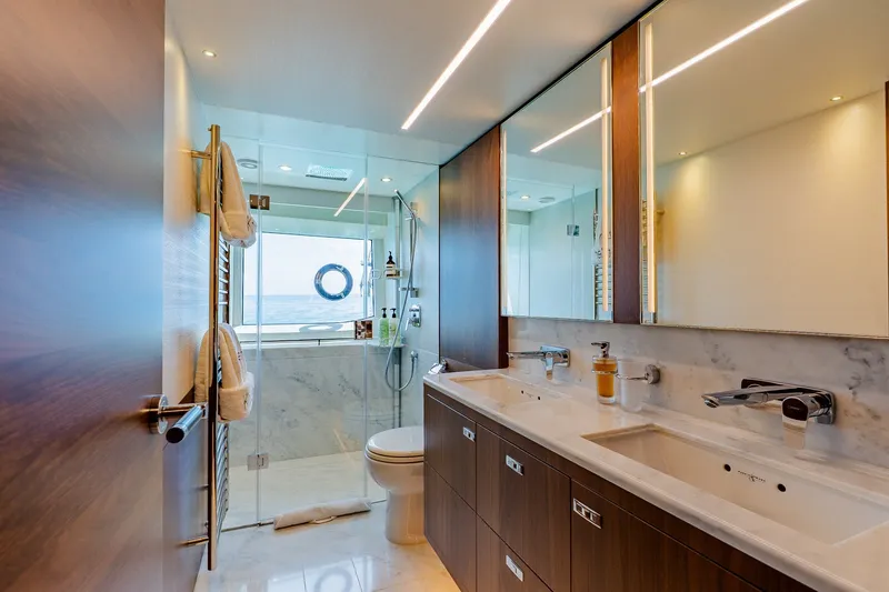 Slide: The Image of Luxurious bathroom on 2022 Princess Y78 yacht with dual sinks and glass shower. - 22